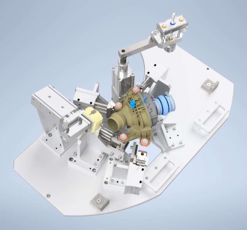 CAD render of an inspection fixture locating a cast housing on datum pins with a pneumatic swing clamp